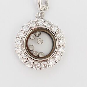 Sterling silver circular pendant with faux diamonds